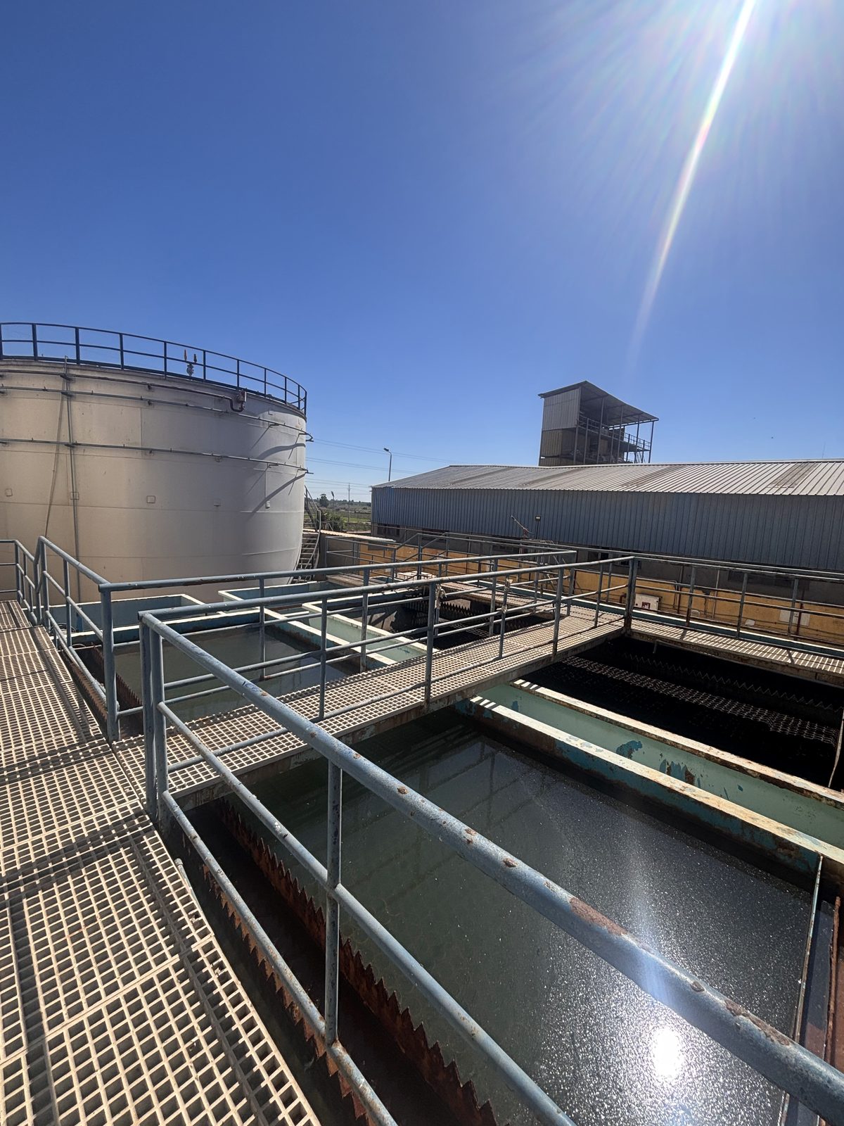 Storage tank and treatment walkways